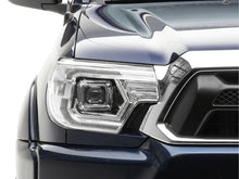 Load image into Gallery viewer, Raxiom 12-15 Toyota Tacoma Axial Series Switchback Projector Headlights- Chrome- Clear Lens | TT23360