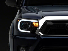 Load image into Gallery viewer, Raxiom 12-15 Toyota Tacoma Axial Series Projector Headlights w/ LED Bar- Blk Housing (Clear Lens) Headlights Raxiom