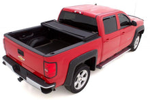 Load image into Gallery viewer, Lund 14-17 Chevy Silverado 1500 (8ft. Bed) Genesis Elite Tri-Fold Tonneau Cover - Black LUND