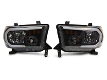 Load image into Gallery viewer, Raxiom 07-13 Toyota Tundra Axial Series Headlights w/ LED Bar- Blk Housing (Clear Lens) Headlights Raxiom