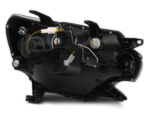 Load image into Gallery viewer, Raxiom 12-15 Toyota Tacoma Axial Projector Headlights w/ SEQL LED Bar- Blk Housing (Clear Lens) Headlights Raxiom