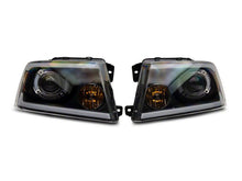 Load image into Gallery viewer, Raxiom 04-08 Ford F-150 Axial Series Projector Headlights w/ SEQL LED Bar- Blk Housing (Clear Lens) Headlights Raxiom