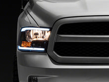 Load image into Gallery viewer, Raxiom 09-18 Dodge RAM 1500/2500/3500 Axial Series Headlights w/ LED Bar- Blk Housing (Clear Lens) Headlights Raxiom