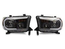 Load image into Gallery viewer, Raxiom 07-13 Toyota Tundra Axial Series Headlights w/ SEQL LED Bar- Blk Housing (Clear Lens) Headlights Raxiom