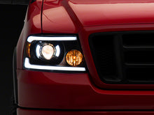Load image into Gallery viewer, Raxiom 04-08 Ford F-150 Axial Series Projector Headlights with LED Bar- Black Housing- Clear Lens | T566363