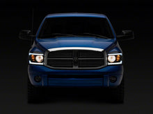Load image into Gallery viewer, Raxiom 06-09 Dodge RAM 1500/2500/3500 Axial Headlights w/ SEQL LED Bar- Blk Housing (Clear Lens) Headlights Raxiom