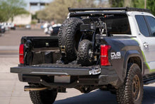 Load image into Gallery viewer, DV8 Offroad Truck Bed Universal Tire Carrier & Accessory Mount