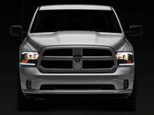Load image into Gallery viewer, Raxiom 09-18 Dodge RAM 1500/2500/3500 Axial Series Headlights w/ LED Bar- Blk Housing (Clear Lens) Headlights Raxiom