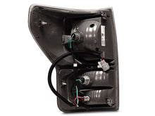 Load image into Gallery viewer, Raxiom 07-13 Toyota Tundra Axial Series Dual C-Shape LED Tail Lights- Black Housing- Smoked Lens | TU9917