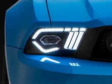 Load image into Gallery viewer, Raxiom 10-12 Ford Mustang w/ Factory Halogen LED Projector Headlights- Blk Housing (Clear Lens) Headlights Raxiom
