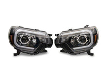 Load image into Gallery viewer, Raxiom 12-15 Toyota Tacoma Axial Series Projector Headlights w/ LED Bar- Blk Housing (Clear Lens) Headlights Raxiom