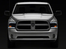 Load image into Gallery viewer, Raxiom 09-18 Dodge RAM 1500/2500/3500 Axial Headlights w/ SEQL LED Bar- Blk Housing (Clear Lens) Headlights Raxiom