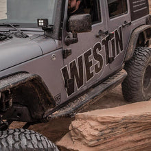 Load image into Gallery viewer, Westin/Snyper 07-17 Jeep Wrangler Unlimited Triple Tube Rock Rail Steps - Textured Black Westin