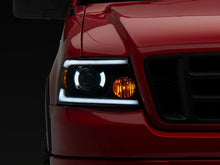 Load image into Gallery viewer, Raxiom 04-08 Ford F-150 Axial Series Projector Headlights w/ SEQL LED Bar- Blk Housing (Clear Lens) Headlights Raxiom