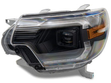 Load image into Gallery viewer, Raxiom 12-15 Toyota Tacoma Axial Series Switchback Projector Headlights- Black Housing- Clear Lens | TT23359