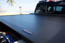 Load image into Gallery viewer, Roll-N-Lock 15-17 Chevy Silverado/Sierra 2500/3500 77-3/8in E-Series Retractable Tonneau Cover Tonneau Covers - Retractable Roll-N-Lock
