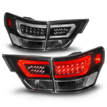 Load image into Gallery viewer, ANZO 11-13 Jeep Grand Cherokee LED Taillights w/ Lightbar Black Housing/Clear Lens 4pcs Tail Lights ANZO