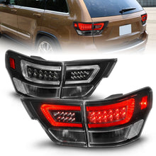 Load image into Gallery viewer, ANZO 11-13 Jeep Grand Cherokee LED Taillights w/ Lightbar Black Housing/Clear Lens 4pcs Tail Lights ANZO