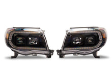 Load image into Gallery viewer, Raxiom 05-11 Toyota Tacoma Axial Series Switchback Projector Headlights- Black Housing- Clear Lens | TT23361
