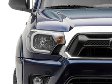 Load image into Gallery viewer, Raxiom 12-15 Toyota Tacoma Axial Series Headlights w/ LED Bar- Blk Housing (Clear Lens) Headlights Raxiom
