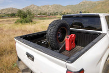 Load image into Gallery viewer, DV8 Offroad Truck Bed Universal Tire Carrier &amp; Accessory Mount
