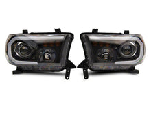 Load image into Gallery viewer, Raxiom 07-13 Toyota Tundra Axial Projector Headlights w/ SEQL LED Bar- Blk Housing (Clear Lens) Headlights Raxiom
