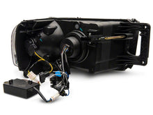 Load image into Gallery viewer, Raxiom 02-05 Dodge RAM 1500 LED Projector Headlights w/ SEQL LED Bar- Blk Housing (Clear Lens) Headlights Raxiom
