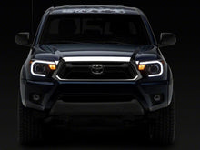 Load image into Gallery viewer, Raxiom 12-15 Toyota Tacoma Axial Projector Headlights w/ SEQL LED Bar- Blk Housing (Clear Lens) Headlights Raxiom
