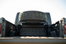 Load image into Gallery viewer, DV8 Offroad 2020+ Jeep Gladiator JT Adjustable In-Bed Tire Carrier
