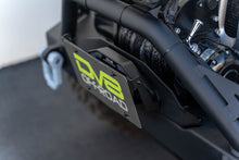 Load image into Gallery viewer, DV8 Offroad Fairlead Mounted Flip-Up License Plate Bracket DV8 Offroad
