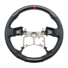Load image into Gallery viewer, NRG 12-23 Toyota Tacoma OEM Plus Carbon Fiber Steering Wheel w/ Blue Stitch &amp; Red Center Mark | RST-TA3-CBL
