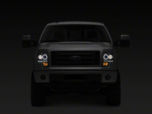 Load image into Gallery viewer, Raxiom 09-14 Ford F-150 G2 Super White LED Halo Projector Headlights- Black Housing- Clear Lens | T542835
