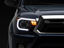 Load image into Gallery viewer, Raxiom 12-15 Toyota Tacoma Axial Projector Headlights w/ SEQL LED Bar- Blk Housing (Clear Lens) Headlights Raxiom
