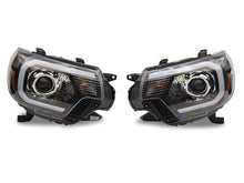 Load image into Gallery viewer, Raxiom 12-15 Toyota Tacoma Axial Projector Headlights w/ SEQL LED Bar- Blk Housing (Clear Lens) Headlights Raxiom
