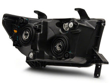 Load image into Gallery viewer, Raxiom 07-13 Toyota Tundra Axial Series Projector Headlights w/ LED Bar- Blk Housing (Clear Lens) Headlights Raxiom
