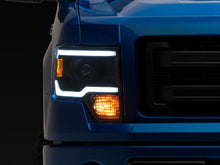 Load image into Gallery viewer, Raxiom 09-14 Ford F-150 Axial Series Projector Headlights w/ LED Light Bar- Blk Housing (Clear Lens) Headlights Raxiom
