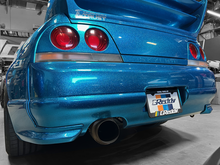 Load image into Gallery viewer, GReddy Total Tune Up License Plate Frame - 3 Color | 21112000
