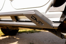 Load image into Gallery viewer, DV8 Offroad 2007-2018 Jeep Wrangler JK 4-Door Rock Sliders
