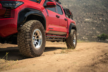 Load image into Gallery viewer, DV8 Offroad 24-25 Toyota Tacoma Double Cab Rock Sliders
