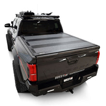 Load image into Gallery viewer, Westin 2024 Toyota Tacoma 2WD/4WD 5ft. Bed Hard Tri-Fold Tonneau Cover - Black Westin

