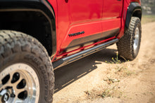 Load image into Gallery viewer, DV8 Offroad 24-25 Toyota Tacoma Double Cab Rock Sliders
