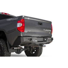 Load image into Gallery viewer, Addictive Desert Designs Bumpers - Steel Addictive Desert Designs 2014+ Toyota Tundra Stealth Fighter Rear Bumper w/ Backup Sensor Cutouts
