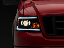 Load image into Gallery viewer, Raxiom 04-08 Ford F-150 Axial Series Projector Headlights w/ SEQL LED Bar- Blk Housing (Clear Lens) Headlights Raxiom
