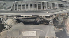 Load image into Gallery viewer, J&amp;L 21-25 Chevy Express/ GMC Savana 6.6L Oil Separator 3.0 Driver Side - Black Anodized
