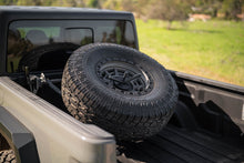 Load image into Gallery viewer, DV8 Offroad 2020+ Jeep Gladiator JT Adjustable In-Bed Tire Carrier
