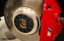 Load image into Gallery viewer, BMW XM G09 wheel spacers by Burger Motorsports installed on a brake rotor with red M brake caliper
