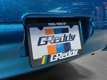 Load image into Gallery viewer, GReddy Total Tune Up License Plate Frame - 3 Color | 21112000
