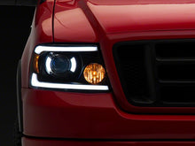 Load image into Gallery viewer, Raxiom 04-08 Ford F-150 Axial Series Projector Headlights with LED Bar- Black Housing- Clear Lens | T566363
