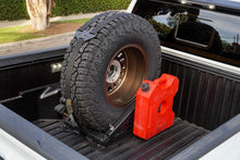 Load image into Gallery viewer, DV8 Offroad Truck Bed Universal Tire Carrier &amp; Accessory Mount
