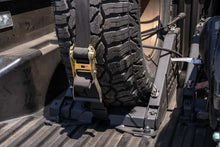 Load image into Gallery viewer, DV8 Offroad Truck Bed Universal Tire Carrier &amp; Accessory Mount
